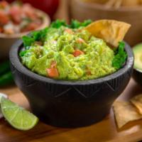 Guacamole & Chips · Fresh housemade guacamole served with warm and crispy tortilla chips.