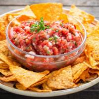 Chips & Salsa · Fresh made salsa served with warm and crispy tortilla chips.