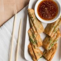 Scallion Pancake · scallion pancake.  served with a soy ginger sauce **must have**