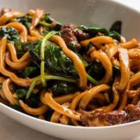 Short Rib Dan Mein Noodles · handmade thick noodles with short rib , snow pea leaves, shitake mushrooms, garlic and our s...