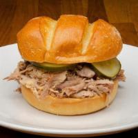 Sandwich-Pulled Pork · Built on a Potato Bun with ¼ lb. portion of hand pulled - Slow Smoked Pork Sholder.