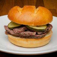 Sandwich-Tri Tip · Built on a Potato Bun with ¼ lb. portion of dry aged and dry rubbed slow Smoked Tri Tip.