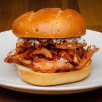 Sandwich-Kickin' Chicken · Built on a Potato Bun  with ¼ lb. portion of Smoked Chicken - toss in hot wing sauc - Blue c...