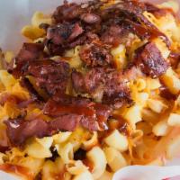 Mac Daddy Fries · A big basket of French fries with mac & cheese, cheddar cheese, wonder sauce, and pastrami.