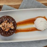 Peanut Butter Molten Cake · vanilla bean gelato, candied peanuts.