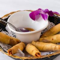 Shrimp In Blanket · Deep fried shrimp with ground chicken wrapped in spring roll skin. Served with sweet and sou...
