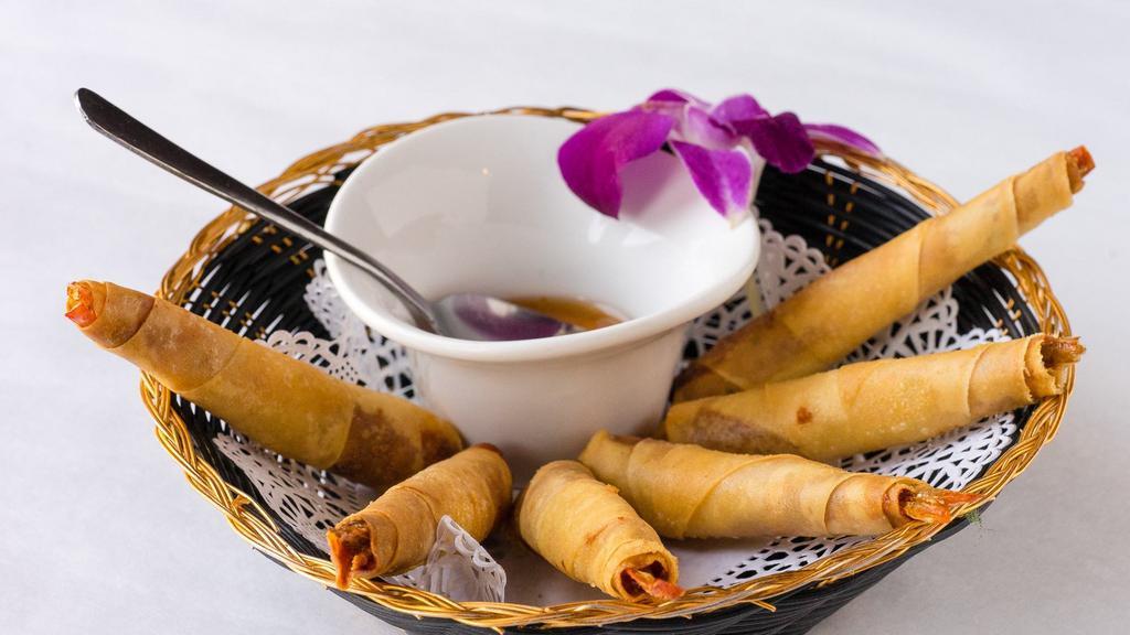 Shrimp In Blanket · Deep fried shrimp with ground chicken wrapped in spring roll skin. Served with sweet and sour sauce.