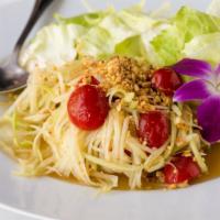 Green Papaya Salad · Shredded green papaya with peanuts, tomato, and garlic. Served over lettuce with lime dressi...