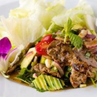 Thai Grilled Beef Salad · Medium-well, tender, grilled beef slices with cucumber, tomato, sweet onion, cilantro and mi...