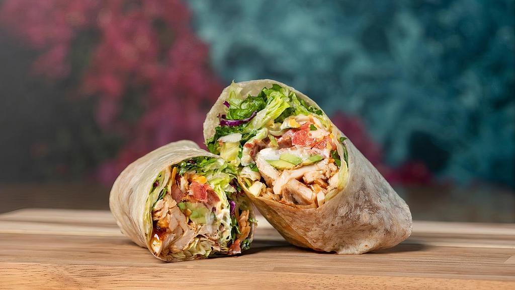 Chicken Club Wrap  · Grilled & Chilled sliced chicken breast, all-natural hickory smoked bacon, avocado, cheddar, jack, lettuce, tomato, ranch dressing & BBQ sauce. Served in a flour tortilla.