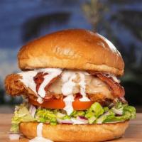 Moa Crisp · Hand breaded fried chicken breast, all-natural hickory smoked bacon, Swiss, red onion, lettu...