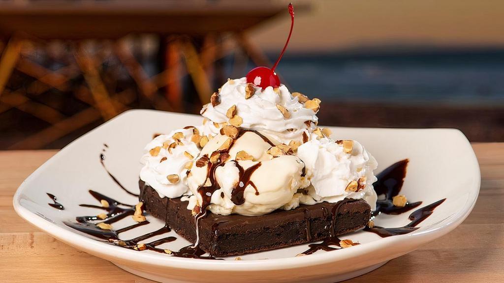 Chocolate Lava  · Perfect for sharing! Fudge brownie topped with vanilla ice cream, chocolate syrup, roasted almonds & a cherry.