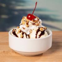 Ice Cream Sundae  · Two scoops of vanilla ice cream, chocolate syrup, roasted almonds & a cherry.