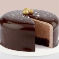 Chocolate Ice Cream Cake · Rich, chocolate ice cream and chocolate cake frosted with chocolate cream and chocolate gana...