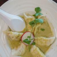 Steamed Dumpling With Curry Sauce · Spicy. Our spiciness is authentic. Chicken dumplings served with spicy coconut green curry s...