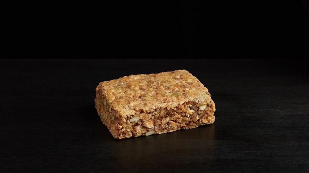 Almond Butter & Oat Breakfast Bar · Almond butter, oats, vanilla, coconut, dried cranberries, poppy seeds, sunflower seeds, flax seeds, and sesame seeds baked into a soft tender breakfast square