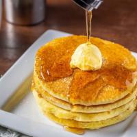 Pancakes Stack · 4 Buttery pancakes topped with butter and maple syrup.  Add strawberries & cream for an addi...