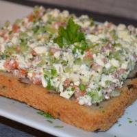 Feta Chop Toast · Feta cheese, tomatoes, cucumbers, dried mint, Italian parsley dressed with lemon and oil on ...