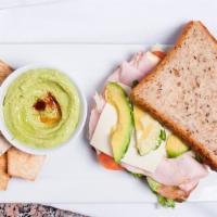 Turkey & Avocado Sandwich · Turkey, avocado, swiss cheese, shredded iceberg lettuce, tomatoes, honey mustard dressing in...