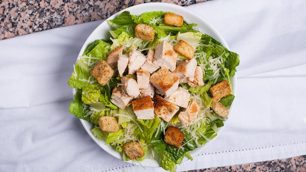 Caesar Salad · Chicken breast filet house marinated, romaine lettuce, parmesan cheese, croutons with Caesar dressing.