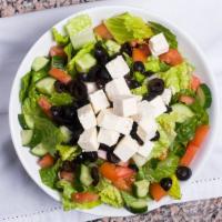 Greek Salad · Romaine lettuce, feta cheese, tomatoes, Persian cucumbers, olives, with our signature vinaig...