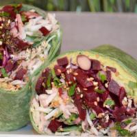 Veggie Wrap · Green leaf hummus, red and green cabbage with arugula dressed in lemon and oil, Persian cucu...