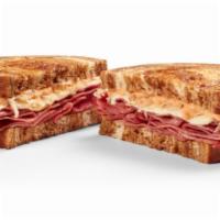 Reuben Only · Corned beef sauerkraut swiss cheese and topped with thousand island on toasted rye bread
