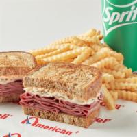 Reuben Combo · Includes fries and drink. Corned beef or pastrami, Swiss cheese, sauerkraut with thousand is...