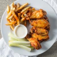 Spicy Buffalo Chicken Wings · With pub fries, ranch dressing & celery.