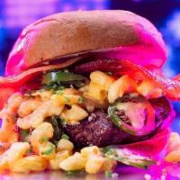 Dirty Mac Burger · 6oz signature burger patty, cheddar mac n cheese, jalapeno, bacon, brioche bun. Served medium.