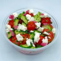 Simple Greek Salad · Cherry tomatoes, cucumber, pickled red onion, feta, and herbs tossed in house vinaigrette.