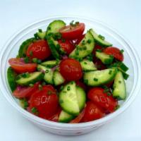 Vegan Simple Greek Salad · Cherry tomatoes, cucumber, pickled red onion, and herbs tossed in house vinaigrette.