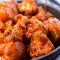 Buffalo Style Cauliflower · Vegetarian. Gluten-free. Crispy cauliflower, buffalo sauce, ranch.