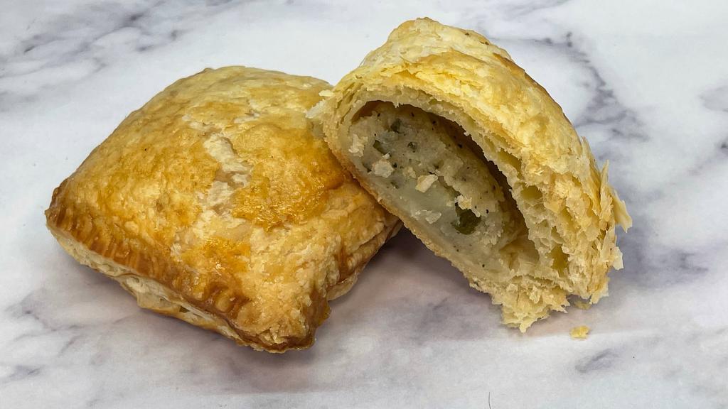 Potato Puff · Warm, flaky pastry dough stuffed with a delicious potato puree' and parsley.