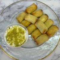 Karabich · 12 pieces of traditional Lebanese cookies made with semolina butter rosewater dough and fill...