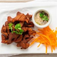 Pork Jerky · Grilled marinated pork served with sweet and sour sauce.