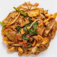 Pad Kee Mow · Stir-fried flat rice noodles, chili, onions, bell peppers, carrots, garlic and basil leaves.