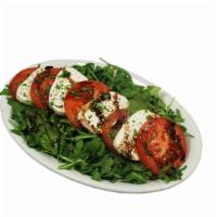 Caprese Salad · Freshly sliced buffalo mozzarella, roma tomatoes, fresh basil, evo, balsamic reduction, salt...