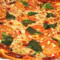 Margherita Pizza · Tomatoes, fresh basil and fresh garlic.