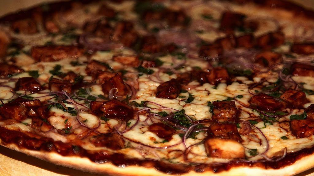 Bbq Chicken Pizza · BBQ chicken, red onions, cilantro, BBQ sauce, and mozzarella cheese.
