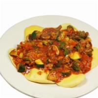 Ravioli Vegetariano · Cheese raviolis with marinara sauce and sautéed fresh garden vegetables.