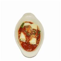 Manicotti · Mozzarella and parmesan cheese blend wrapped in a sheet of pasta, oven-baked with choice of ...