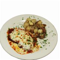 Eggplant Parmigiana · Breaded pan-fried eggplant layered with mozzarella and parmigiana. Baked with choice of meat...