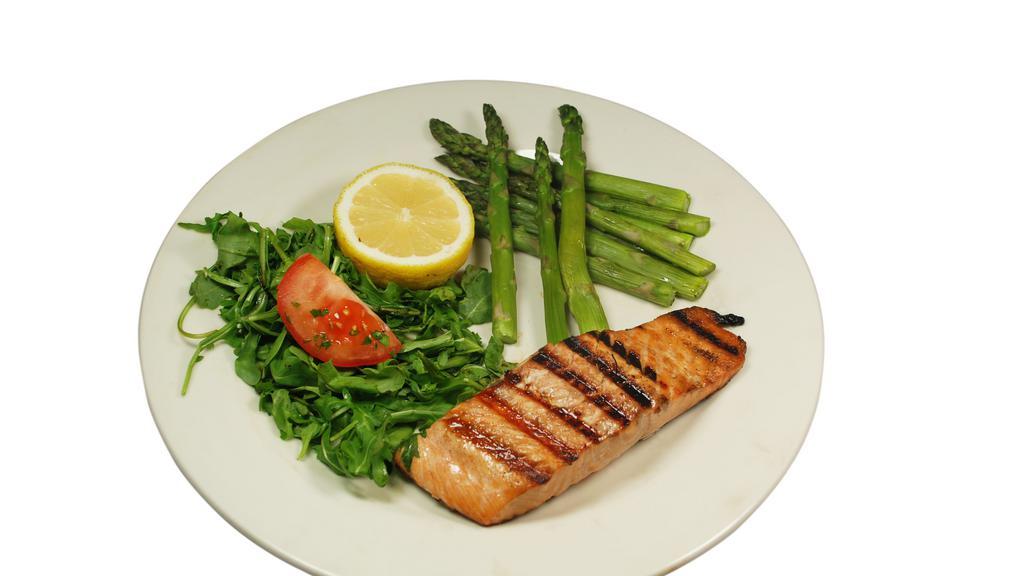 Grilled Salmon · Grilled skinless Atlantic salmon fillet seasoned and finished with a side of our house garlic butter.