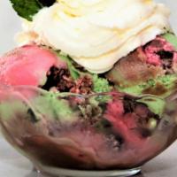 Spumoni Ice Cream · Cherry, pistachio, and chocolate ice cream layers, with candied fruit. Topped with our house...