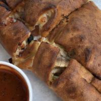 Cheese Calzone · Pizza dough folded and stuffed with ricotta cheese & mozzarella cheese. Oven baked.