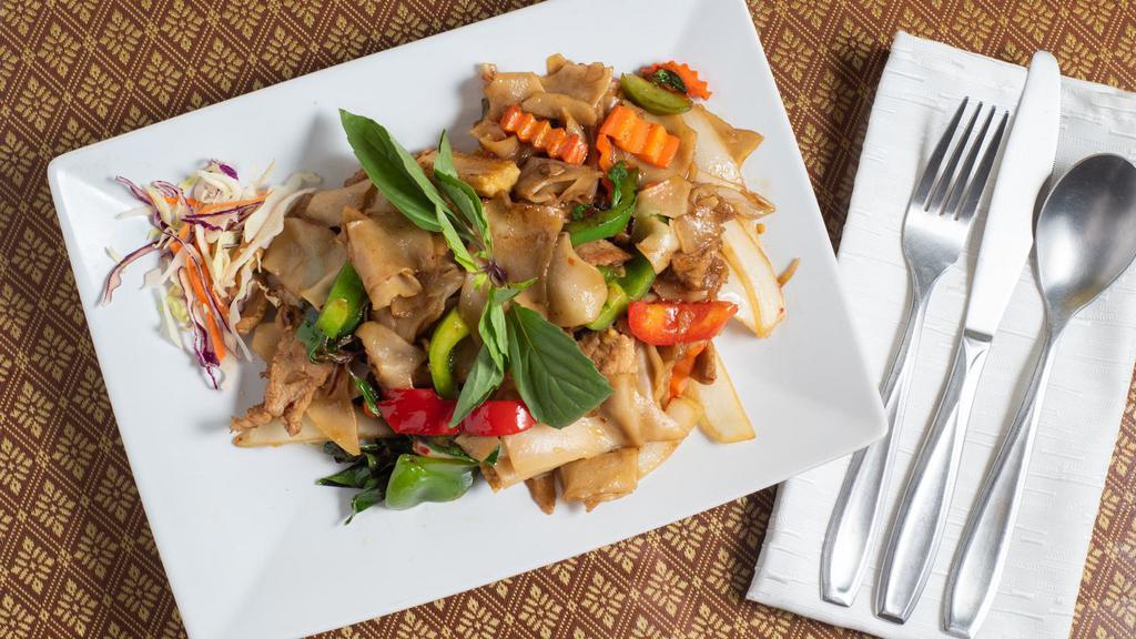 Drunken Noodle · Flat rice noodle pan fried with garlic, chili, mushroom, tomato, bamboo shoot, bell pepper, and basil.