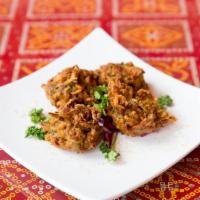 Vegetable Pakora - 4 Pieces · Gently spiced and deep fried veggie patties.