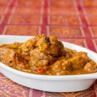 Chicken Madras · Chicken cooked with tomatoes, herbs, spices and special curry sauce.