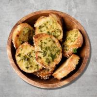 Garlic Bread · Garlic bread, Italian herbs and mozzarella.